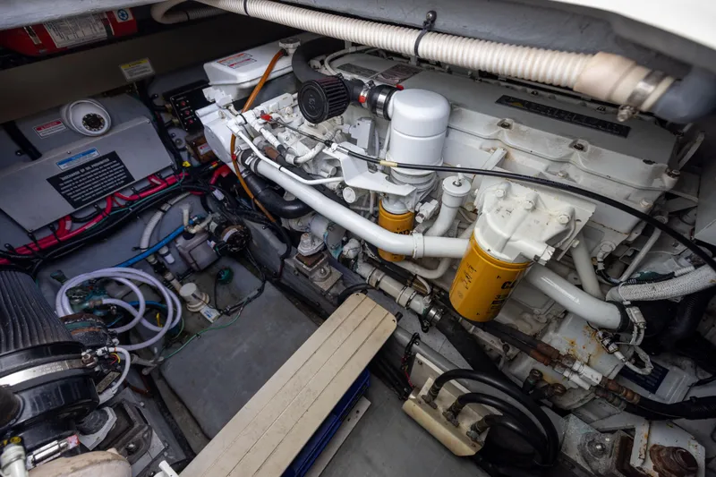 Slide: The Image of Engine room of a 2000 Sea Ray 370 Express Cruiser, showcasing mechanical components. - 40
