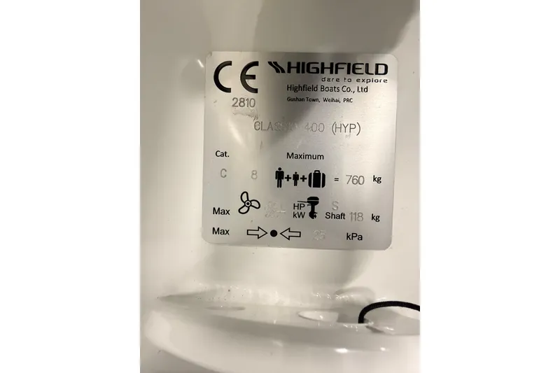 Slide: The Image of Label on Highfield Classic 400 boat, showing specifications and weight limits. - 13