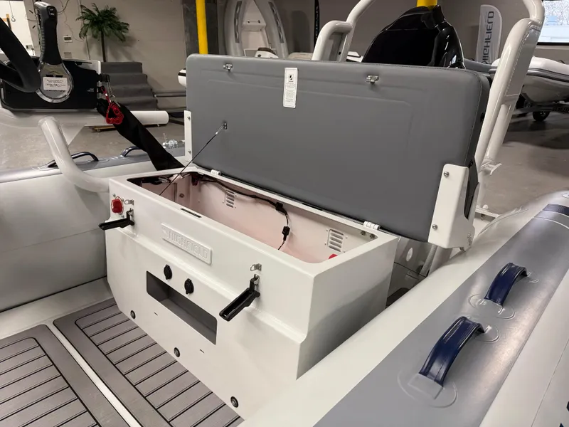 Slide: The Image of 2025 Highfield Classic 400 boat interior with open storage compartment. - 3