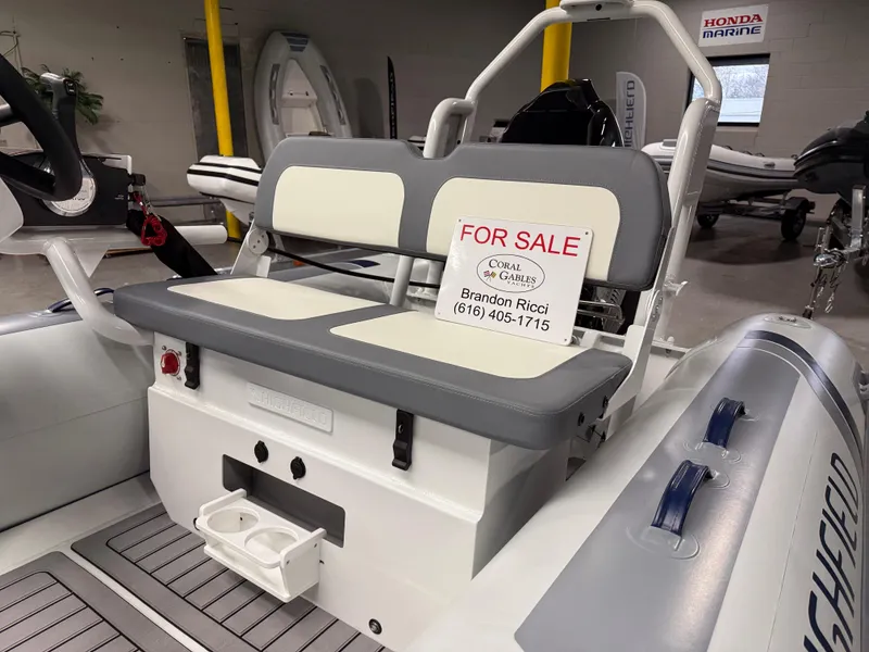 Slide: The Image of 2025 Highfield Classic 400 boat for sale, featuring gray and white seating. - 4