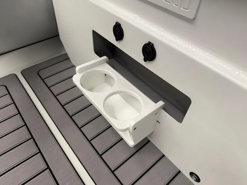 Slide: The Image of Highfield Classic 400 (2025) boat interior with cup holder and deck flooring. - 5