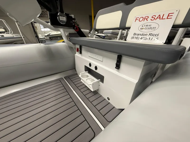 Slide: The Image of 2025 Highfield Classic 400 boat interior with seating and "For Sale" sign. - 6