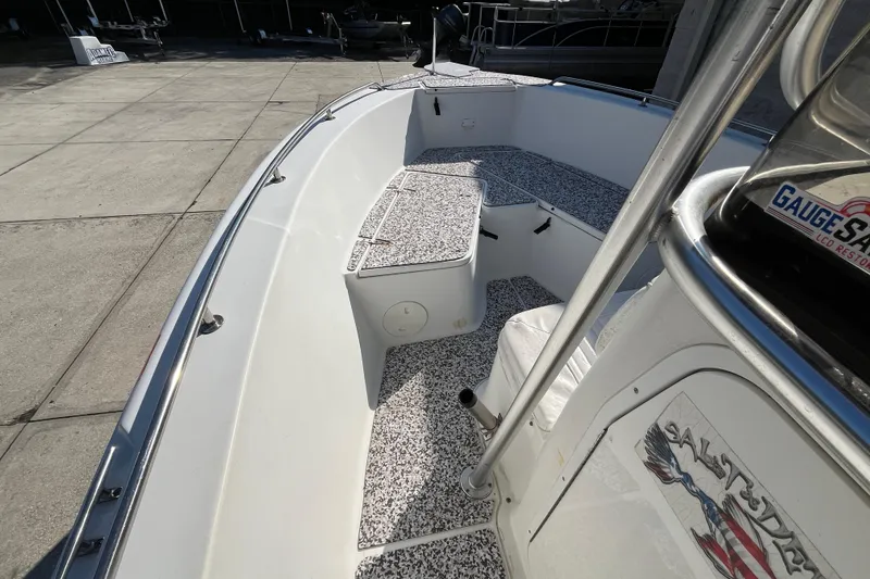 Slide: The Image of 2010 Sea Hunt Triton 220 boat interior with seating and console details. - 14