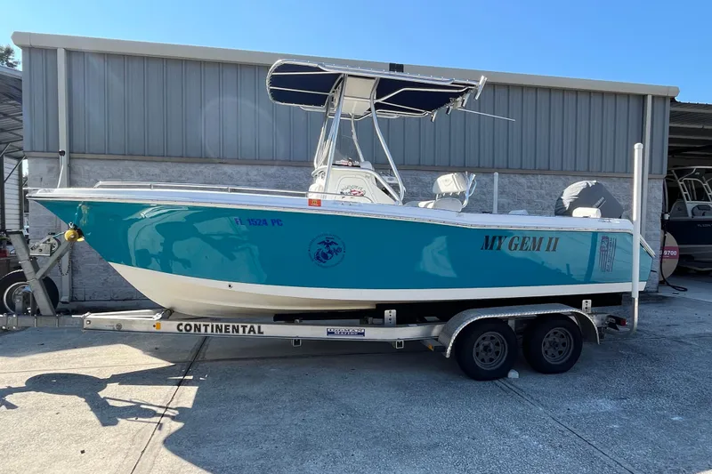 Slide: The Image of 2010 Sea Hunt Triton 220 boat on trailer, parked outdoors. - 25