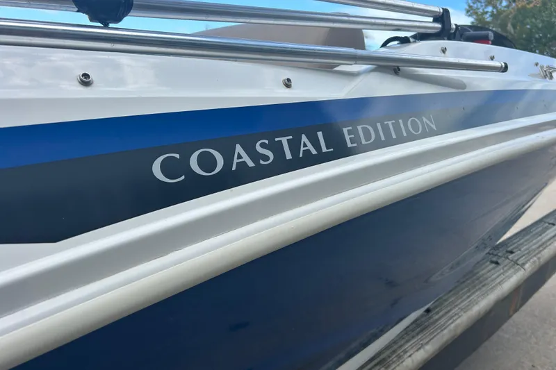 Slide: The Image of 2022 Hurricane SunDeck Sport 185 OB, Coastal Edition boat side view. - 10