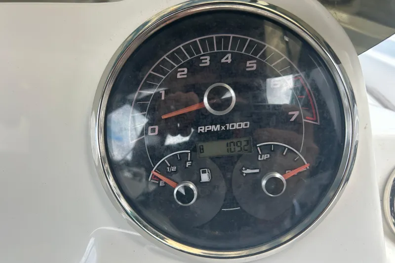 Slide: The Image of Close-up of 2022 Hurricane SunDeck Sport 185 OB boat tachometer showing RPM and fuel gauge. - 14