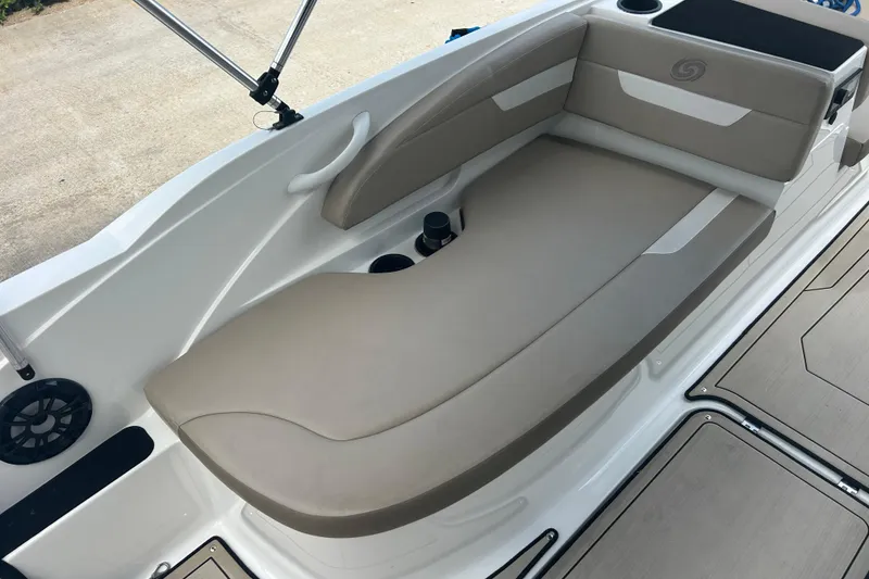 Slide: The Image of 2022 Hurricane SunDeck Sport 185 OB boat interior with beige seating and cup holders. - 17