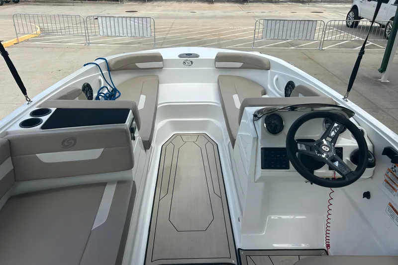 Slide: The Image of 2022 Hurricane SunDeck Sport 185 OB boat interior with steering wheel and seating. - 18