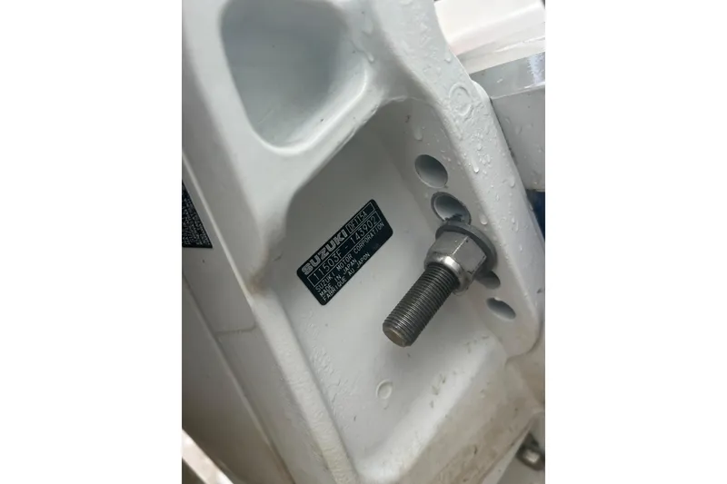 Slide: The Image of Close-up of a 2022 Hurricane SunDeck Sport 185 OB boat engine mount with Suzuki label. - 24