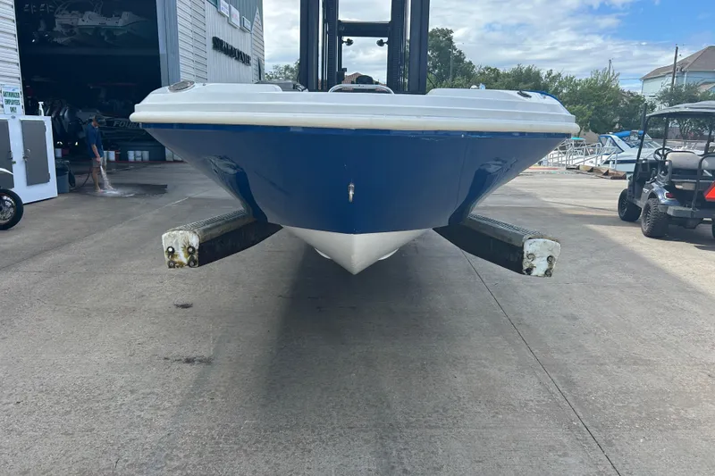 Slide: The Image of 2022 Hurricane SunDeck Sport 185 OB boat on a lift at a marina. - 4