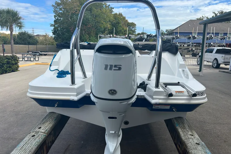 Slide: The Image of 2022 Hurricane SunDeck Sport 185 OB boat with 115 HP outboard motor, docked outdoors. - 5