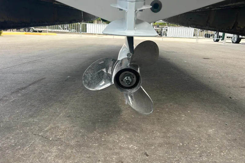 Slide: The Image of 2022 Hurricane SunDeck Sport 185 OB boat propeller on concrete surface. - 8