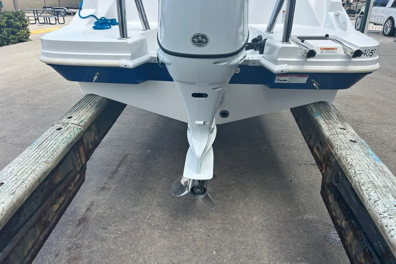 Slide: The Image of 2022 Hurricane SunDeck Sport 185 OB boat on trailer, rear view with outboard motor. - 9