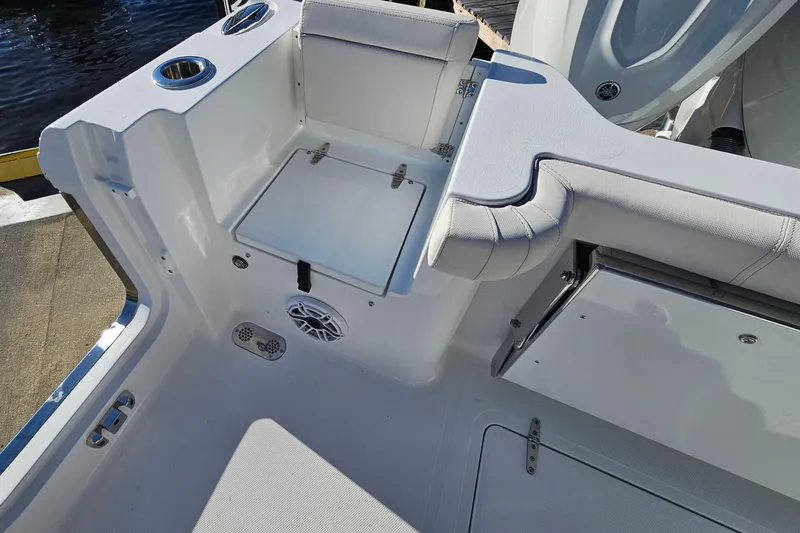 Slide: The Image of 2026 Sea Hunt Gamefish 30 boat interior with seating and storage features. - 10