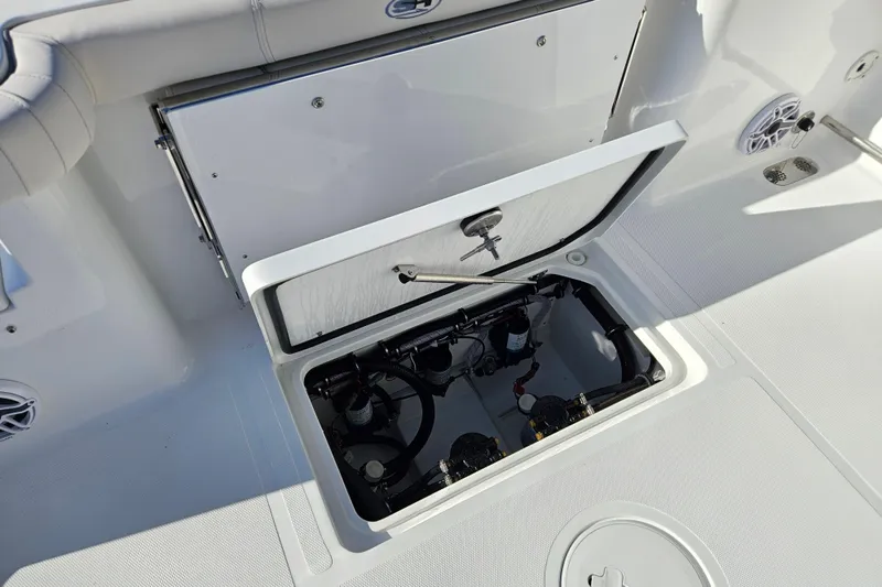 Slide: The Image of 2026 Sea Hunt Gamefish 30 Forward Seating boat with open storage compartment. - 13