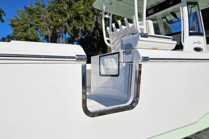 Slide: The Image of 2026 Sea Hunt Gamefish 30 boat with forward seating, featuring sleek white design and stainless steel accents. - 2