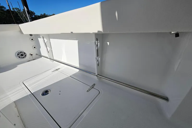 Slide: The Image of 2026 Sea Hunt Gamefish 30 Forward Seating interior with storage and speaker details. - 21