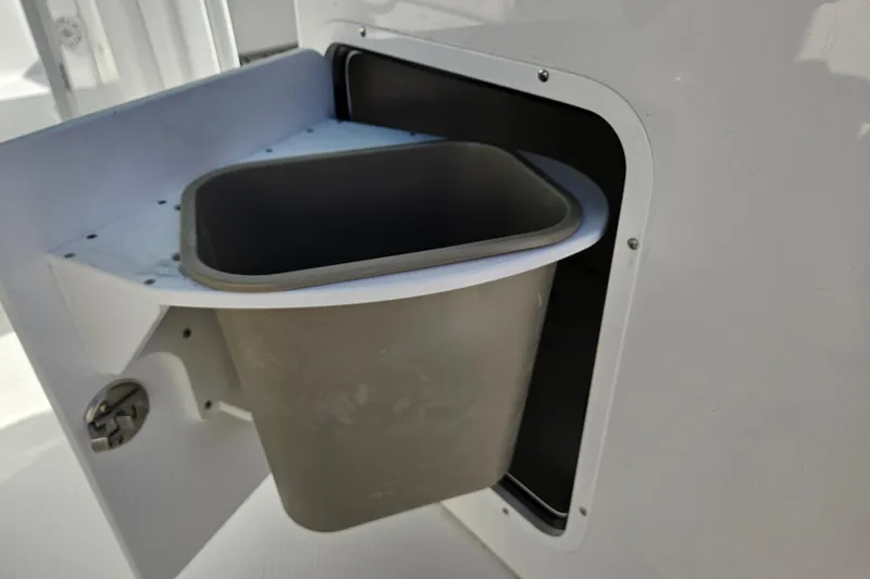 Slide: The Image of Built-in trash compartment on 2026 Sea Hunt Gamefish 30 Forward Seating boat. - 22
