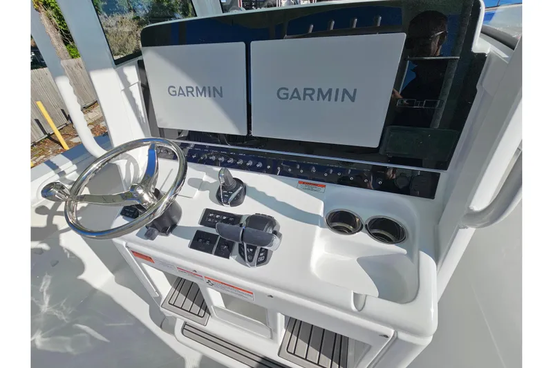 Slide: The Image of 2026 Sea Hunt Gamefish 30 helm with dual Garmin displays and modern controls. - 24