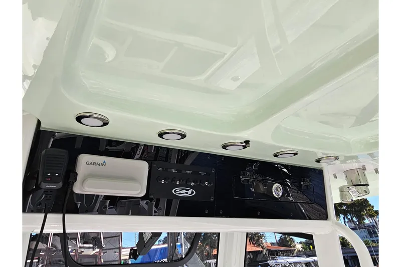 Slide: The Image of 2026 Sea Hunt Gamefish 30 Forward Seating boat console with Garmin electronics and lighting. - 26