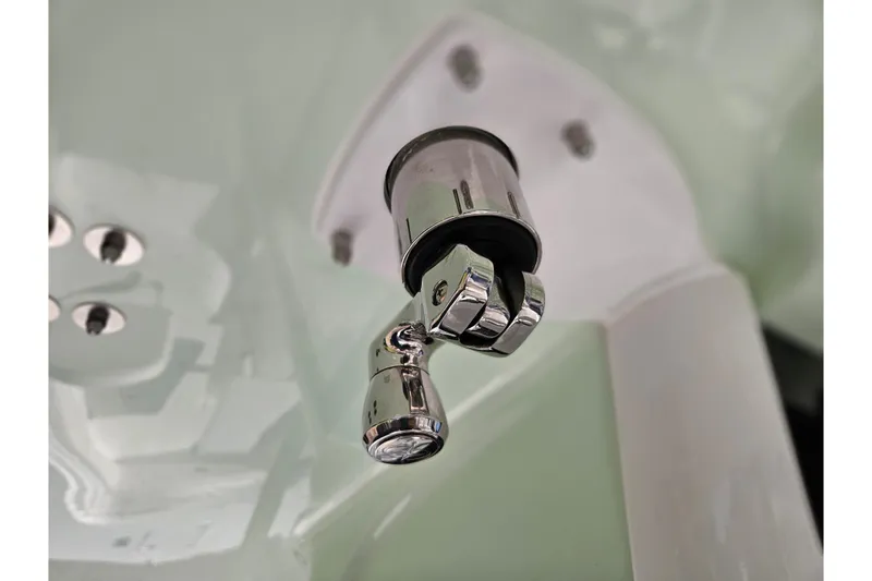 Slide: The Image of Close-up of a chrome fixture on a 2026 Sea Hunt Gamefish 30 boat. - 27