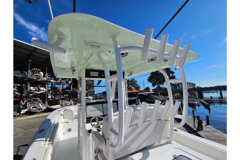 Slide: The Image of 2026 Sea Hunt Gamefish 30 boat with forward seating, docked under clear blue sky. - 39
