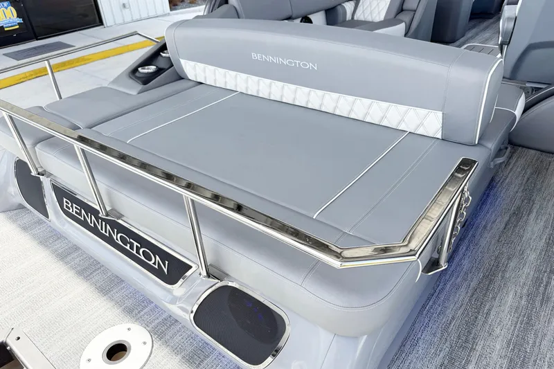 Slide: The Image of 2025 Bennington 23RX boat interior with luxurious gray seating and sleek design. - 11