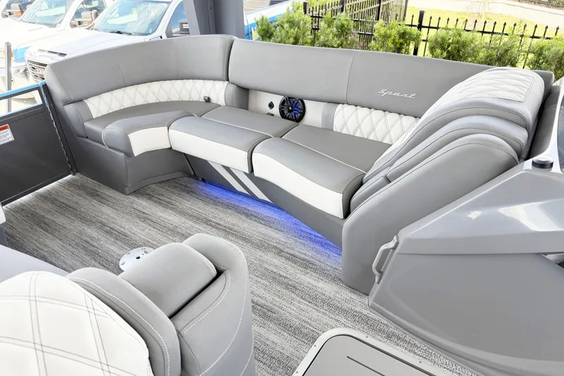 Slide: The Image of Luxurious interior of 2025 Bennington 23RX pontoon boat with plush seating and ambient lighting. - 12