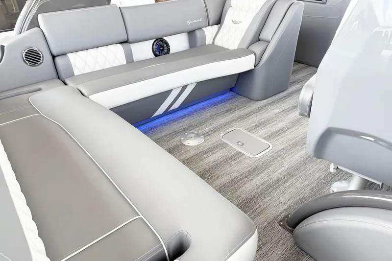 Slide: The Image of Interior of 2025 Bennington 23RX boat with modern seating and ambient lighting. - 6