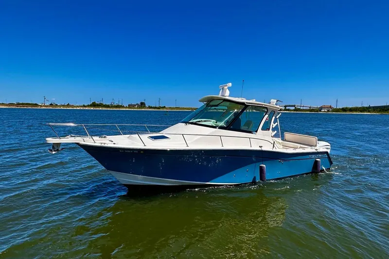 The Image of 2019 Grady-White Express 330 boat docked in marina, front view. - 0