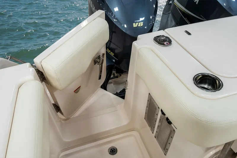 Slide: The Image of Control panel of a 2019 Grady-White Express 330 with Seakeeper and horn switches. - 13