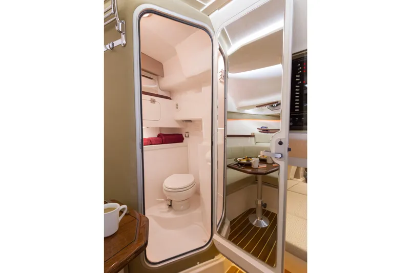 Slide: The Image of 2019 Grady-White Express 330 boat deck with clean, spacious layout and wood-like flooring. - 20