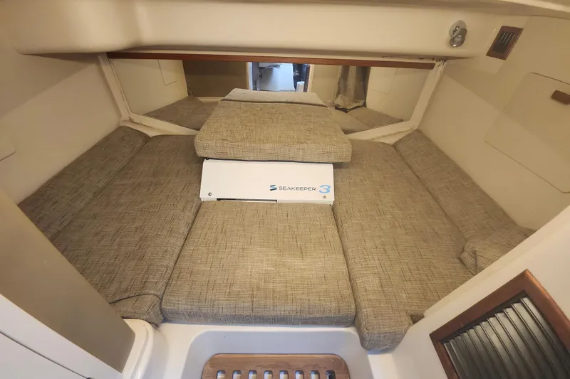 Slide: The Image of 2019 Grady-White Express 330 cabin interior with Seakeeper 3 stabilizer. - 25