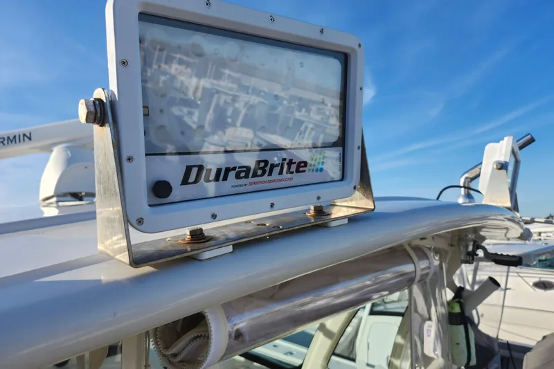 Slide: The Image of DuraBrite light on 2019 Grady-White Express 330 boat, clear sky background. - 33