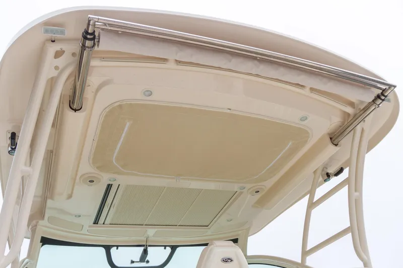 Slide: The Image of 2019 Grady-White Express 330 boat interior with helm, steering wheel, and seating. - 7