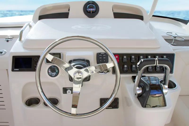Slide: The Image of 2019 Grady-White Express 330 boat interior with seating and control panel. - 8