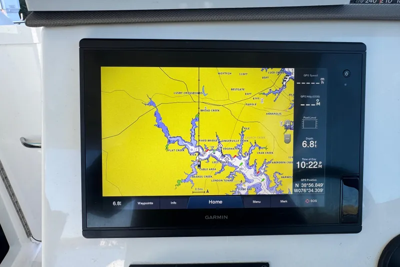 Slide: The Image of Garmin navigation display on 2019 Pursuit DC 325 Dual Console boat, showing detailed waterway map. - 24