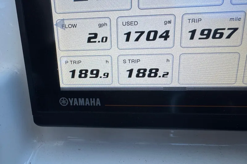 Slide: The Image of Yamaha display showing fuel flow, usage, and trip data on Pursuit DC 325 boat. - 28