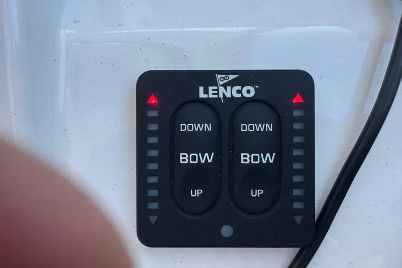Slide: The Image of Lenco trim tab control panel on 2019 Pursuit DC 325 Dual Console boat. - 31
