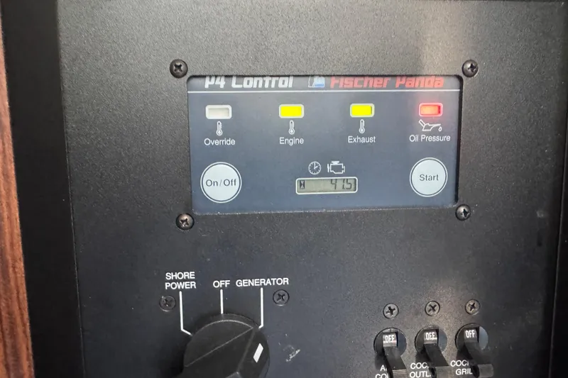 Slide: The Image of Control panel of a 2019 Pursuit DC 325 Dual Console boat, featuring Fischer Panda system. - 35