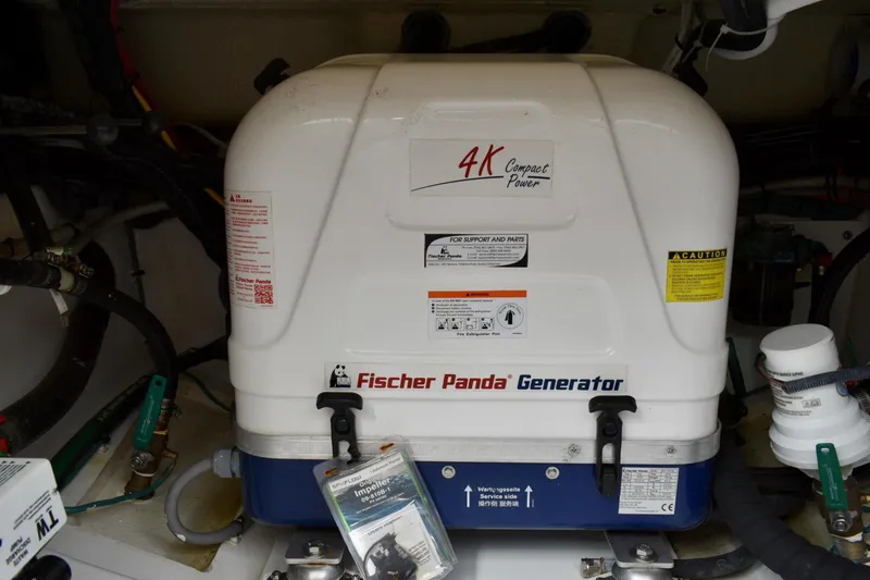 Slide: The Image of Fischer Panda generator in 2019 Pursuit DC 325 Dual Console boat engine room. - 39