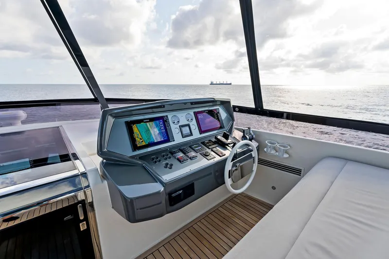 Slide: The Image of Helm of 2020 Ferretti Yachts 920 with ocean view, featuring modern navigation equipment. - 20