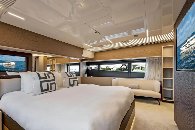Slide: The Image of Luxurious bedroom interior of 2020 Ferretti Yachts 920 with modern design and large windows. - 42