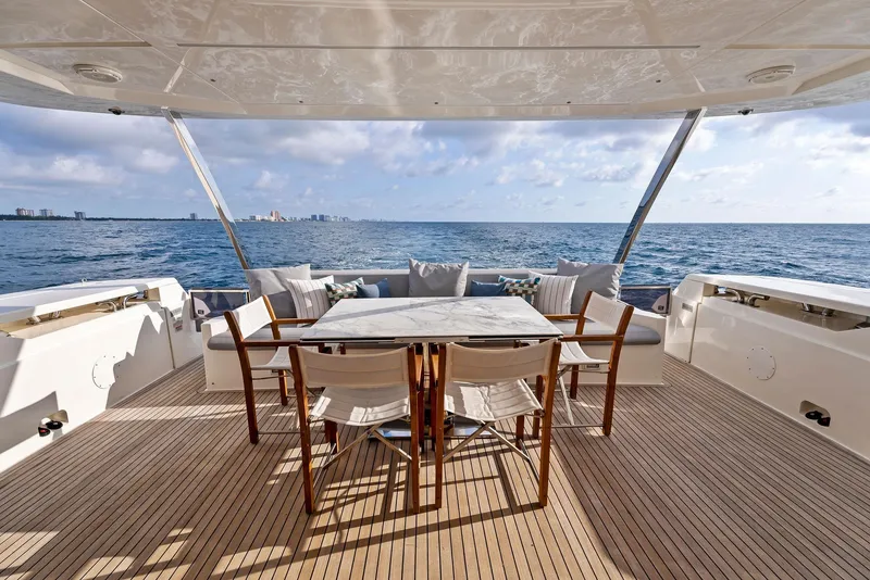 Slide: The Image of Luxurious 2020 Ferretti Yachts 920 deck with elegant seating and ocean view. - 8