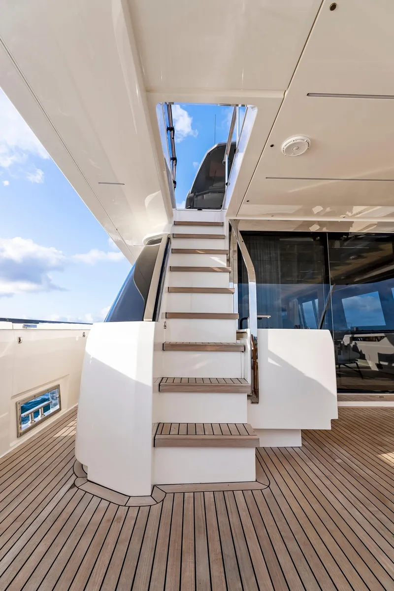 Slide: The Image of Staircase on 2020 Ferretti Yachts 920, featuring sleek design and wooden deck. - 9