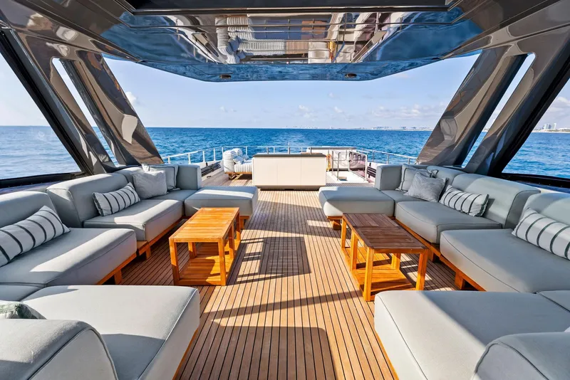 Slide: The Image of Luxurious 2020 Ferretti Yachts 920 interior with elegant seating and ocean view. - 17