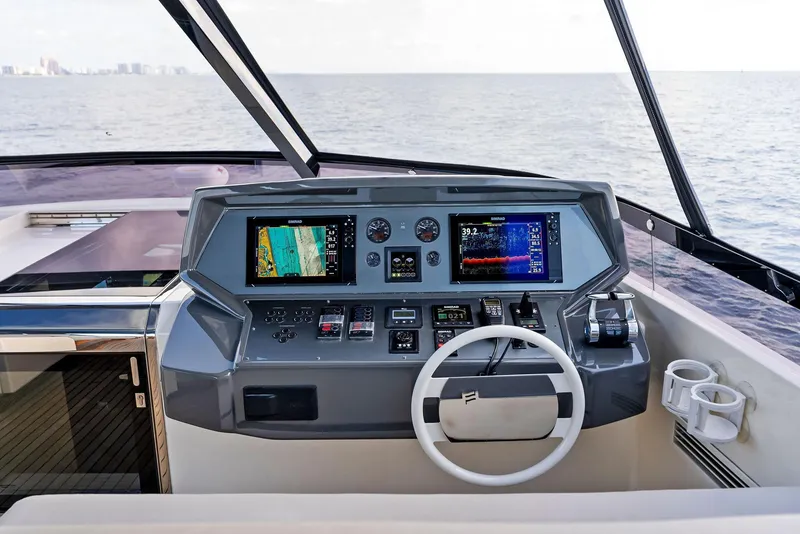 Slide: The Image of 2020 Ferretti Yachts 920 helm with advanced navigation systems and ocean view. - 21