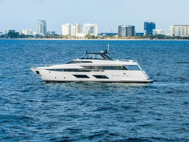 Slide: The Image of 2020 Ferretti Yachts 920 cruising on ocean with city skyline in background. - 3