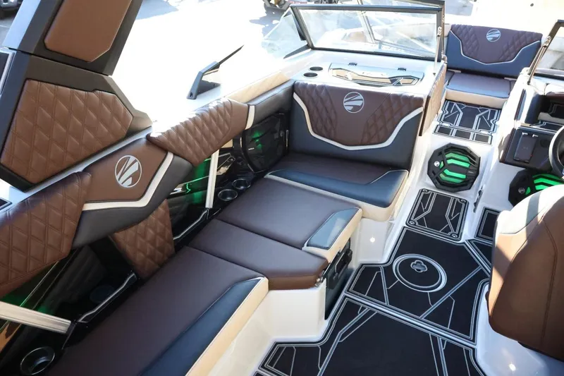 Slide: The Image of 2026 Tigé 24RZX boat interior with luxurious brown seating and modern design elements. - 13