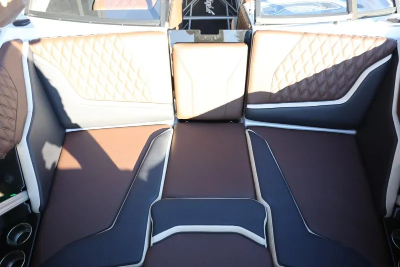 Slide: The Image of 2026 Tigé 24RZX boat interior with luxurious brown and black seating. - 20